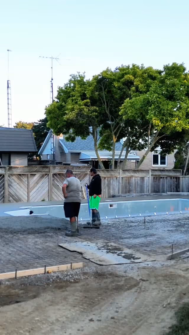 Concrete crew preparing a pool deck with formwork